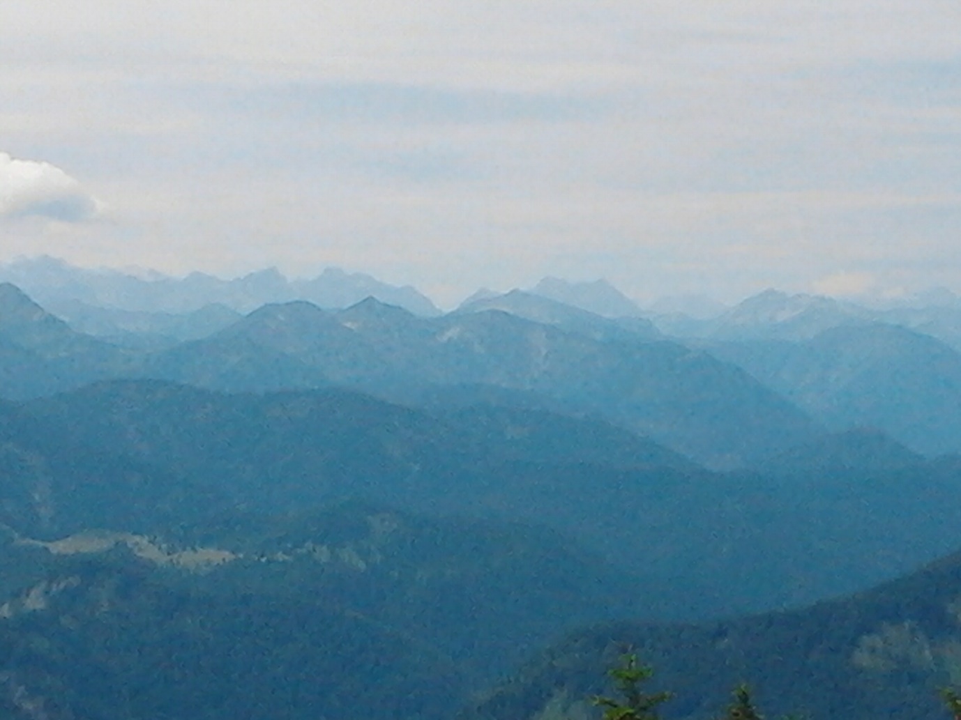 The view of the mountain ranges marking the German–Austrian border, taken from the Setzberg pinnacle (1700 m)